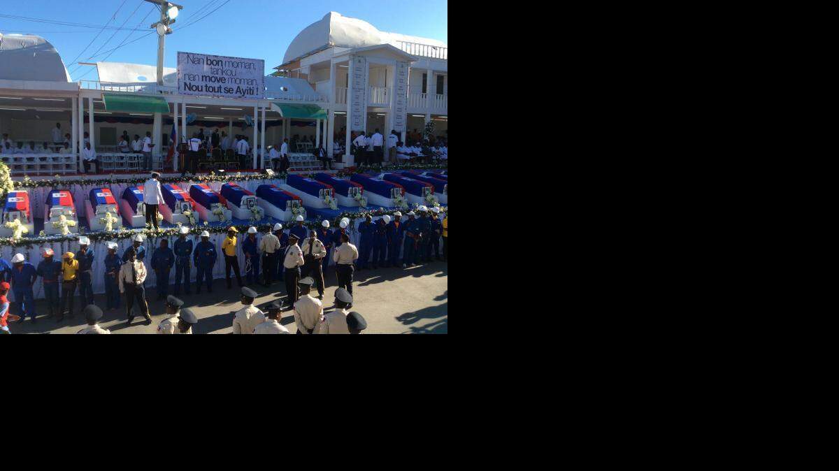 
Four days after the singer of a popular hip-hop group ran into a power line atop a Carnival float, triggering 17 deaths, Haiti bid farewell to the victims with official honors Saturday, Feb. 21, 2015.
