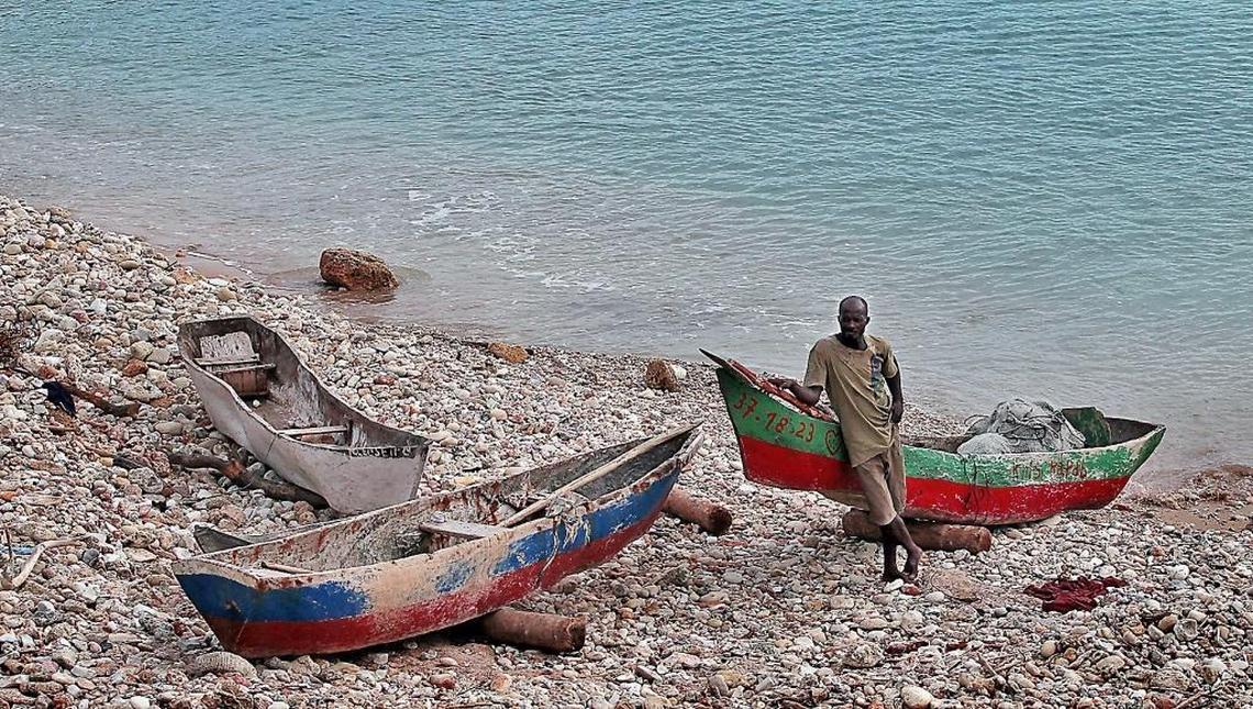 A fisherman prepares to head out on the water along the shore in Port-Salut, Haiti in late June nearly nine months after hurricane Matthew struck the area.