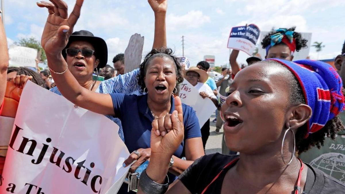 Haitian and immigration advocates hold a rally asking the Trump administration extend Temporary Protected Status for Haitians in front of the U.S. Citizenship and Immigration Services office in Miami on Saturday, May 13, 2017.