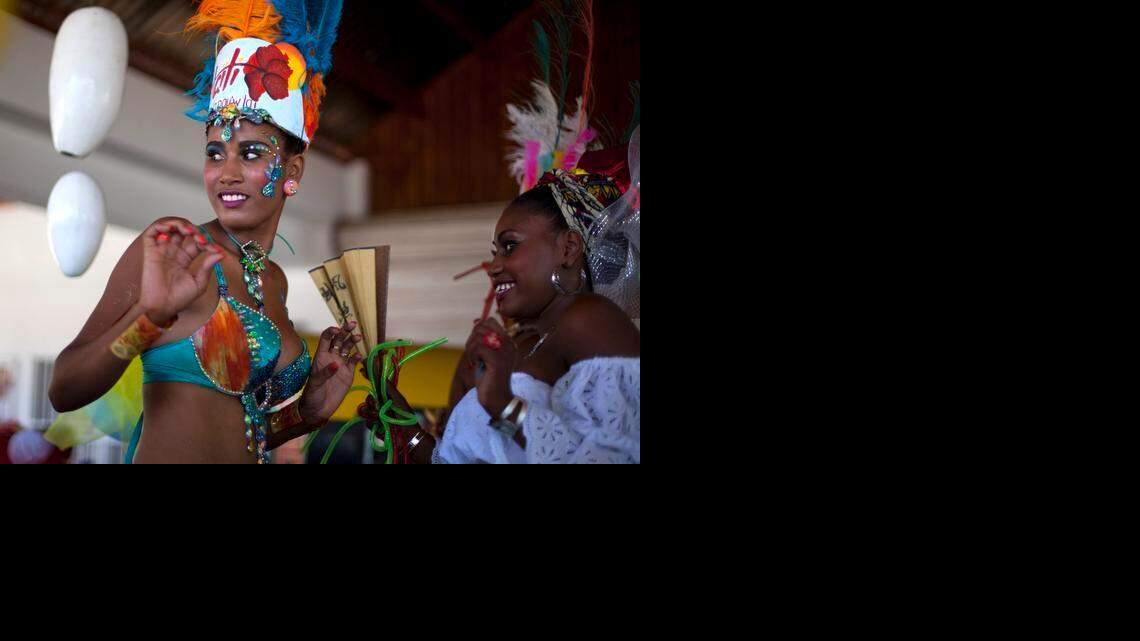 
Carnival Queen Fabienne Francois dances at Carnival celebrations in Jacmel, Haiti, Sunday, Feb. 23, 2014. The Carnival spirit will take hold again this weekend in Jacmel as its annual parade snakes through the downtown of the coastal town in a warm up to Haiti’s National Carnival Feb. 15, 16 and 17, which returns to Port-au-Prince this year. 
