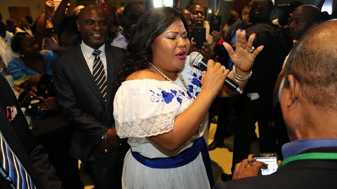 Singer Marie Yonie Marcel performs during a welcome reception to Haitian President Jovenel Moïse and and his wife, Martine Marie Etienne Joseph, by a group of Haitians living in South Florida as he makes his first visit to Miami as president during a community meeting at the Little Haiti Cultural Center on Friday, June 16, 2017.