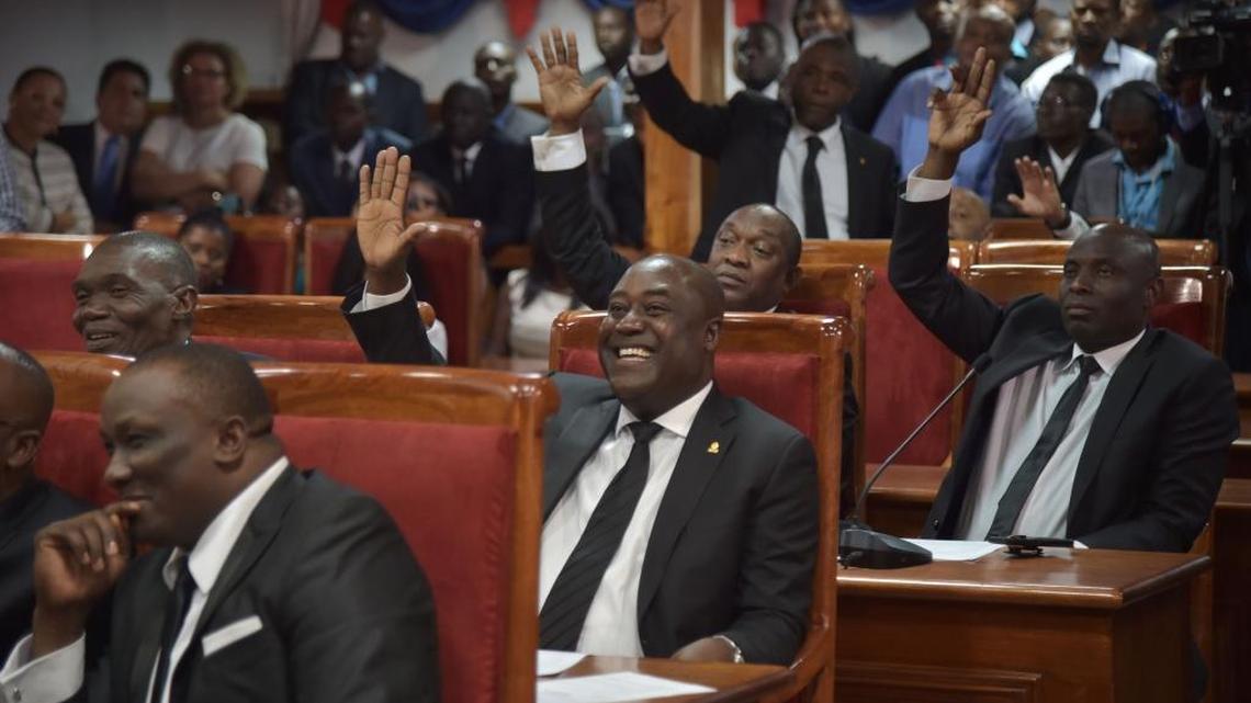 Haitian Senators are pictured during their investiture ceremony in the Haitian Parliament on January 09, 2017 in Port-au-Prince. They are currently debating the country’s budget, which has triggered outrage among Haitians living in the diaspora because of a $159 income tax fee.