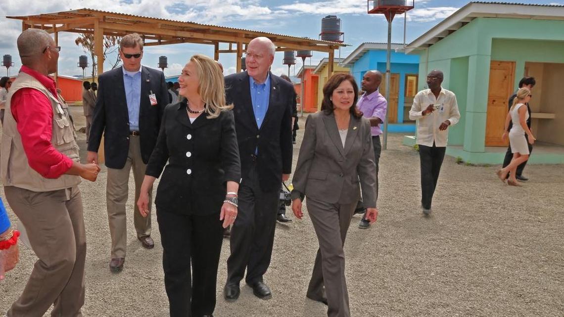U.S. Secretary of State Hillary Clinton, center, tours a housing development near Caracol Industrial Park with Senator Patrick Leahy and the Secretary of Labor Hilda Solis. The park opened for business on Monday, October 22, 2012 in Caracol, Haiti.