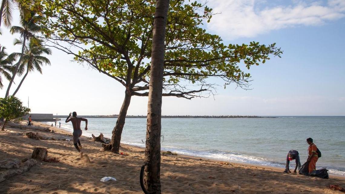 The Dominican Republic attracts more visitors than any other nation in the Caribbean, but they don’t go to the Santo Domingo. Only 15 percent of visitors spend time in the capital. In this photo, employees from the Ministry of Environment clean up Santo Domingo’s Fray Anton de Montesinos beach in hopes of making it more attractive.