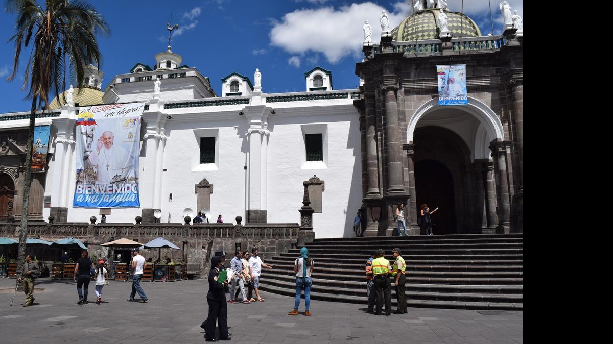 
A poster of Pope Francis hangs on a cathedral in Quito, Ecuador. 
