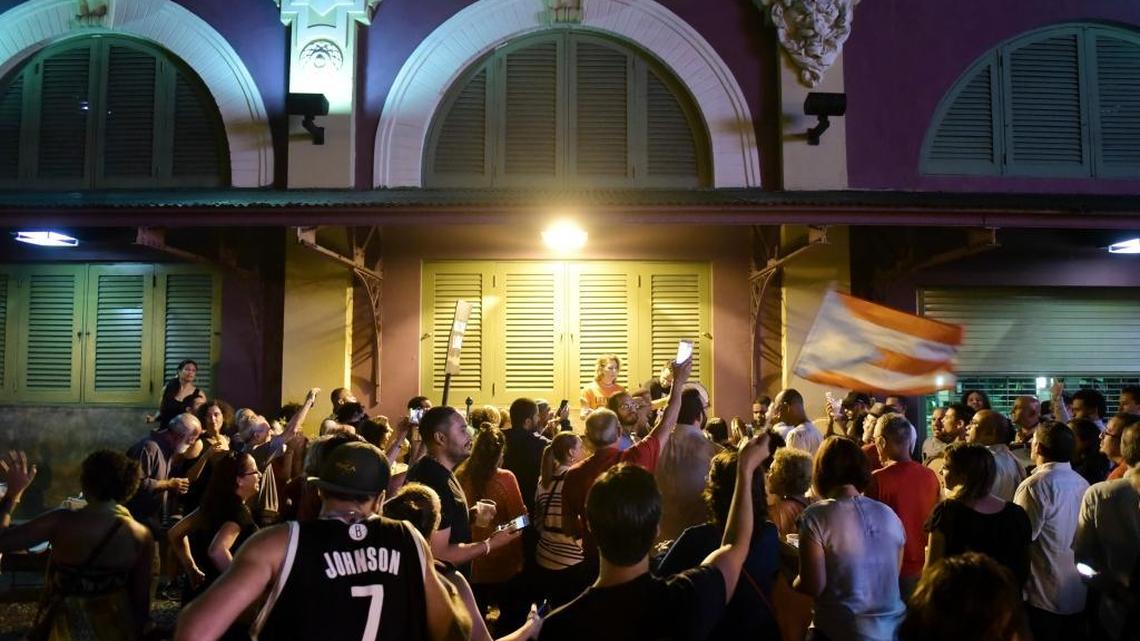 People celebrate after learning that President Barack Obama commuted the sentence for Puerto Rican nationalist Oscar Lopez Rivera, in San Juan, Puerto Rico, on Tuesday. Many Puerto Ricans have long demanded his release.