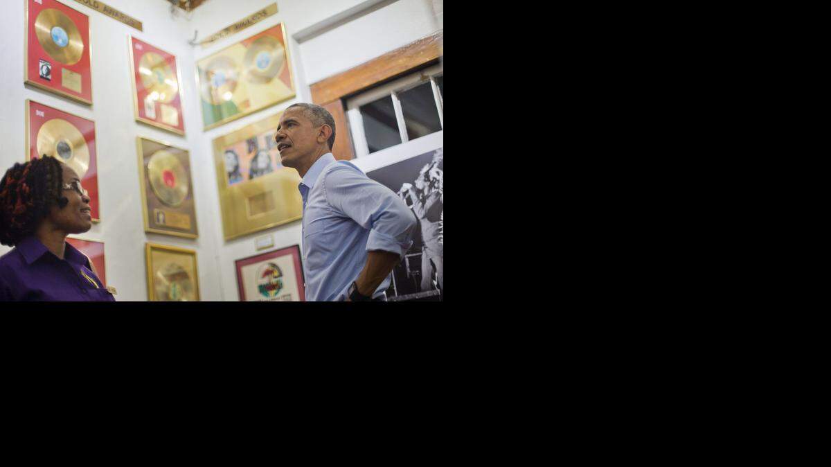 
U.S. President Barack Obama, right, visits the Bob Marley Museum with tour guide Natasha Clark, left, Wednesday, April 8, 2015 in Kingston, Jamaica.

