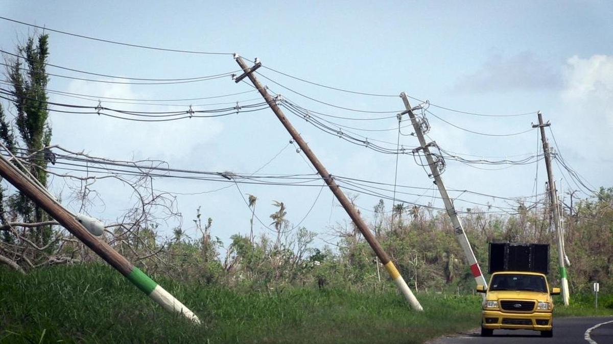 Power lines hang precariously on the side of the road on Highway 118 near San Isidro.