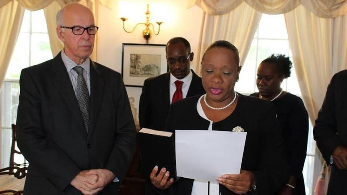 Turks and Caicos Islands Premier Sharlene Cartwright Robinson being sworn in by United Kingdom appointed Governor John Freeman on Tuesday, Dec. 20, 2017. After leading her People's Democratic Movement (PDM) to a landslide victory in this month's general elections, Cartwright Robinson became the first female of the British dependent territory.