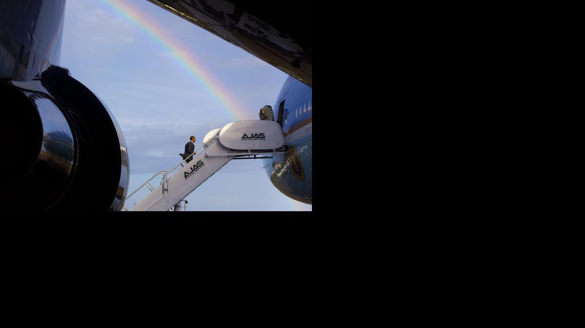 
A rainbow is seen as U.S. President Barack Obama boards Air Force One, Thursday, April 9, 2015, at Norman Manley International Airport in Palisadoes, Jamaica. 

