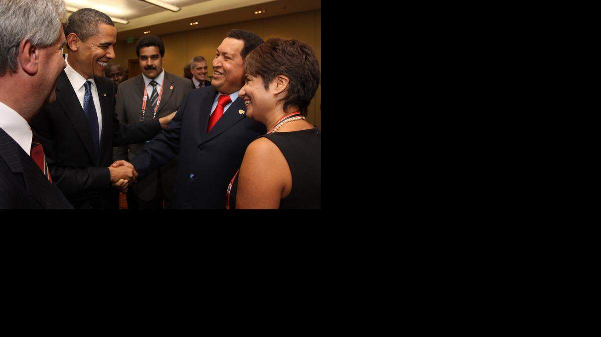 
In this April 17, 2009 file photo, President Barack Obama, left, shakes hands with Venezuela's President Hugo Chavez before the opening session of the 5th Summit of the Americas in Port of Spain, Trinidad and Tobago. Venezuela's Vice President Nicolas Maduro announced on Tuesday, March 5, 2013 that Chavez has died at age 58 after a nearly two-year bout with cancer. (AP Photo/Mariamma Kambon, Summit of the Americas, Pool, File)
