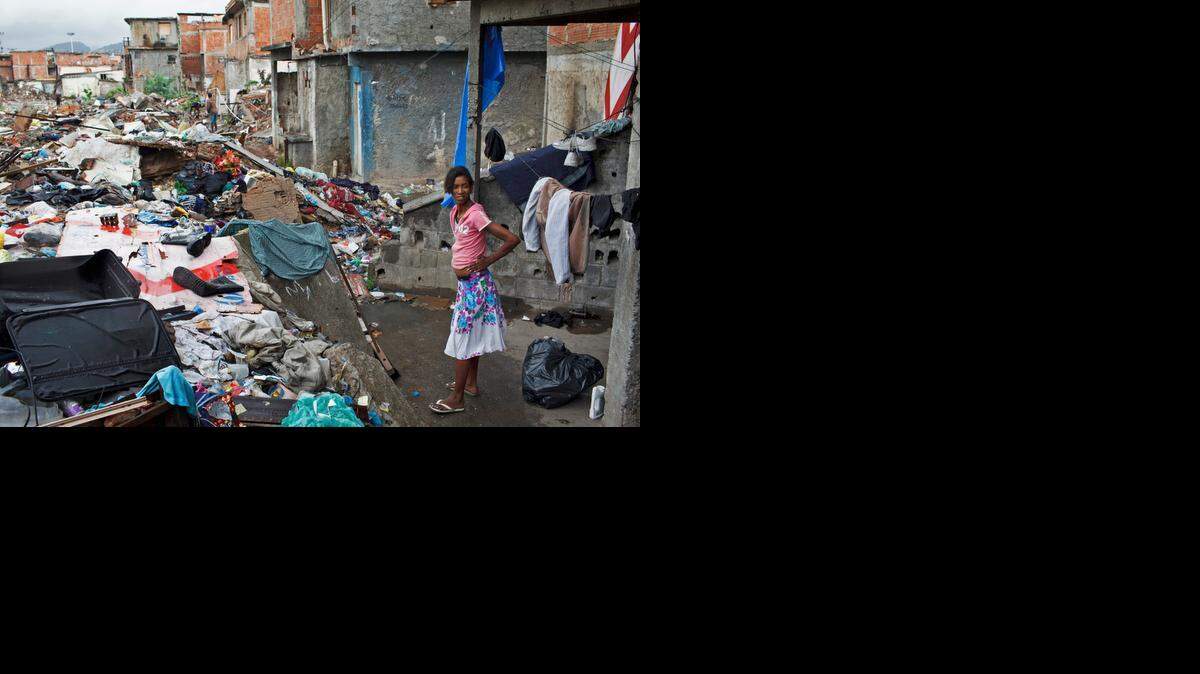 
Thais Nascimento Silva, 26, lives in what is left from a building in the Metro Favela in Rio de Janeiro. 
