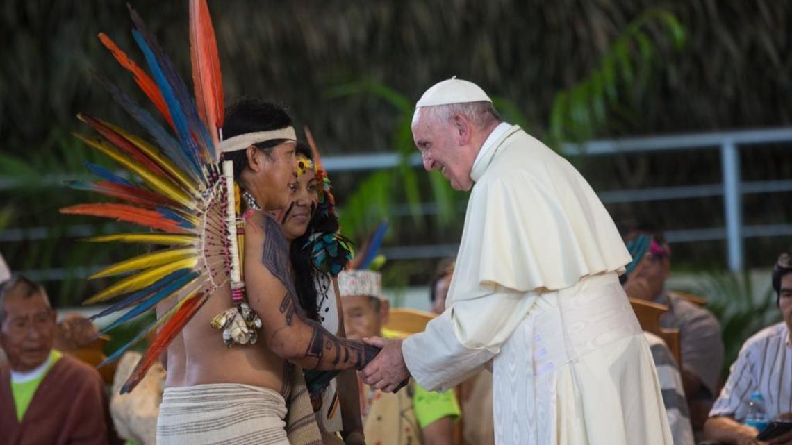 Pope Francis greets indigenous representatives in Puerto Maldonado, Peru, Friday, Jan. 19, 2018. Standing with thousands of indigenous Peruvians, Francis declared the Amazon the “heart of the church” and called for a three-fold defense of its life, land and cultures.