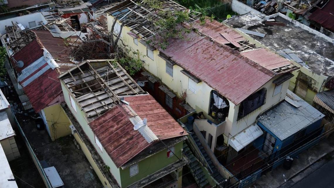 This Nov. 15, 2017, photo shows roofs in San Juan, Puerto Rico, that remain damaged by Hurricane Maria.
