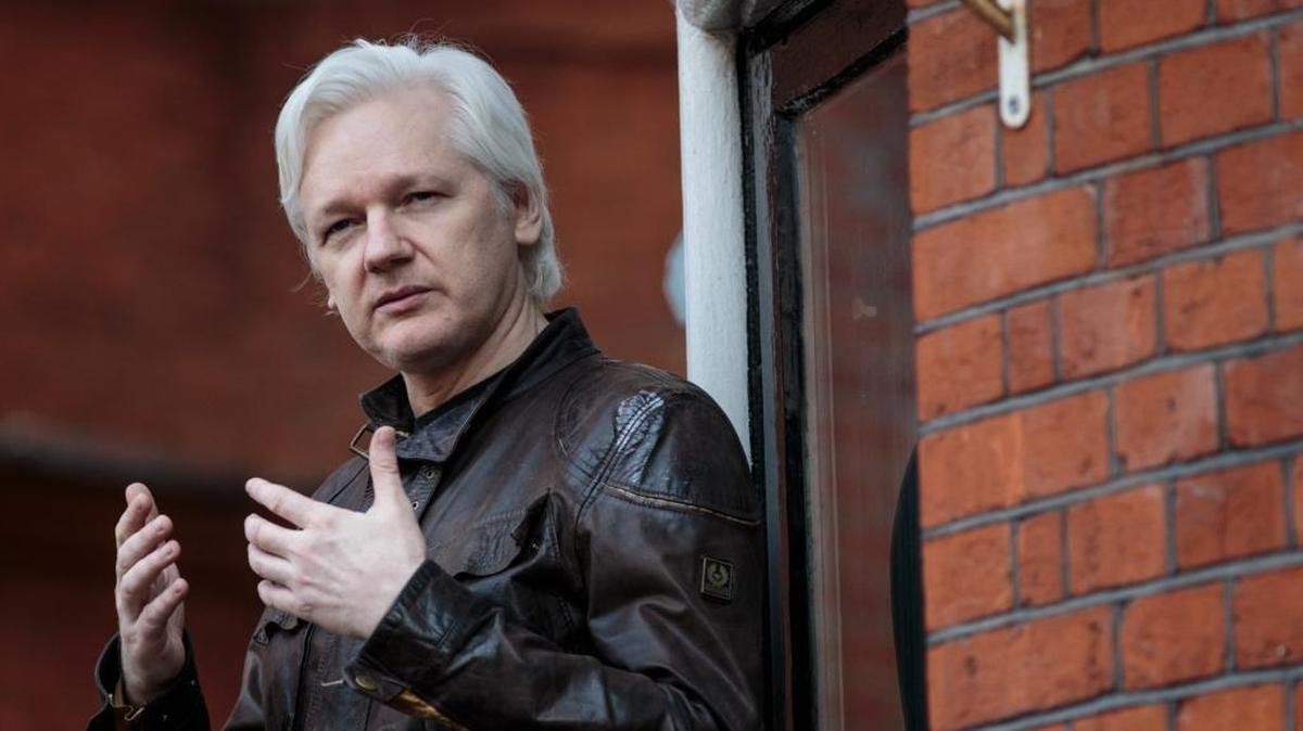 Julian Assange speaks to the media from the balcony of the Ecuador’s embassy on May 19, 2017, in London.