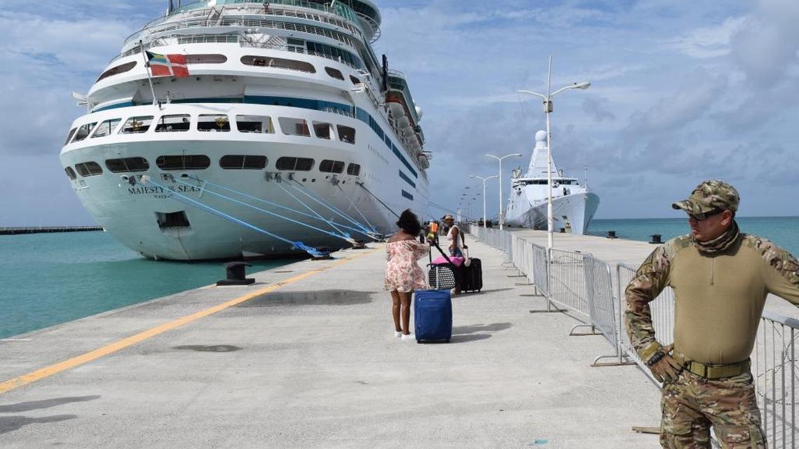 An evacuee from St. Martin walks toward Royal Caribbean’s Majesty of the Seas. The ship ran aid and rescue missions in the wake of Hurricane irma.