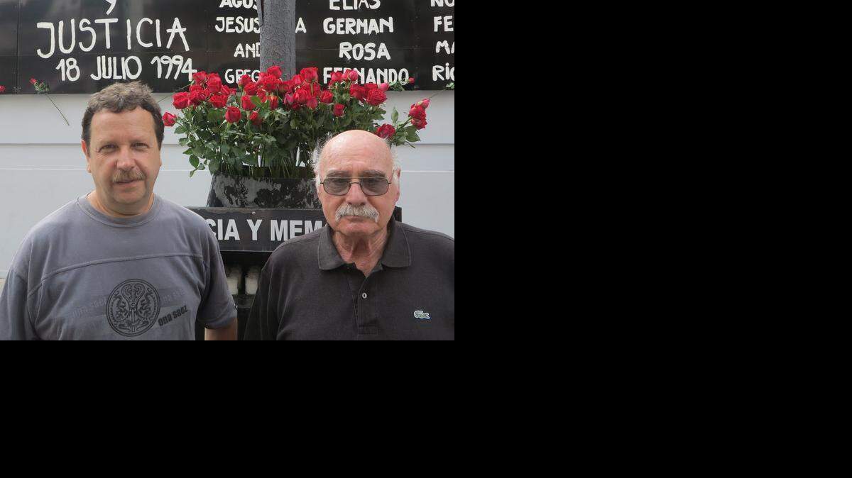 
Gabi Fryszberg (left) and Jacobo Furman at a memorial site for the 85 people who died in the 1994 bombing of the AMIA Jewish cultural center in Buenos Aires, Argentina. Fryszberg was in the building that day and Furman lost a son.
