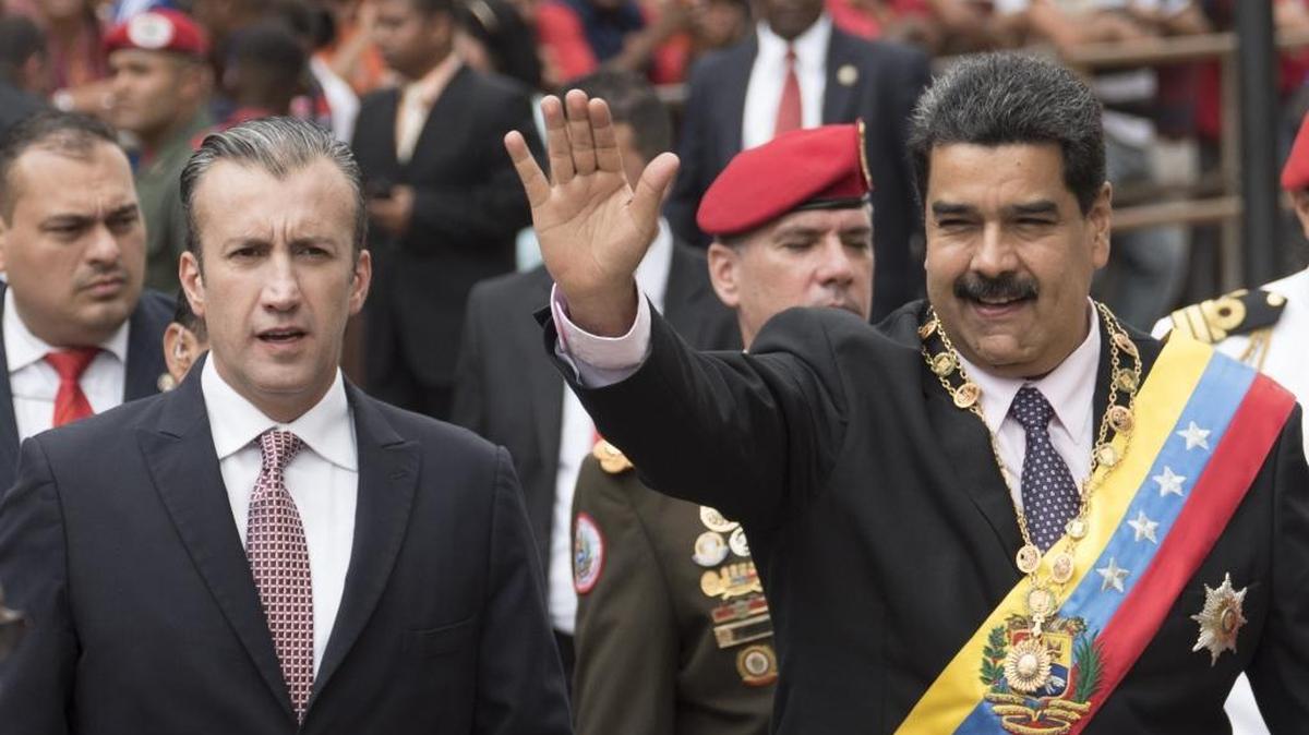 Venezuela’s President Nicolás Maduro, right, waves to attendees, while accompanied by Vice President Tareck El Aissami, before the start of his annual address at the Supreme Court in Caracas, Venezuela, on Jan. 15, 2017.