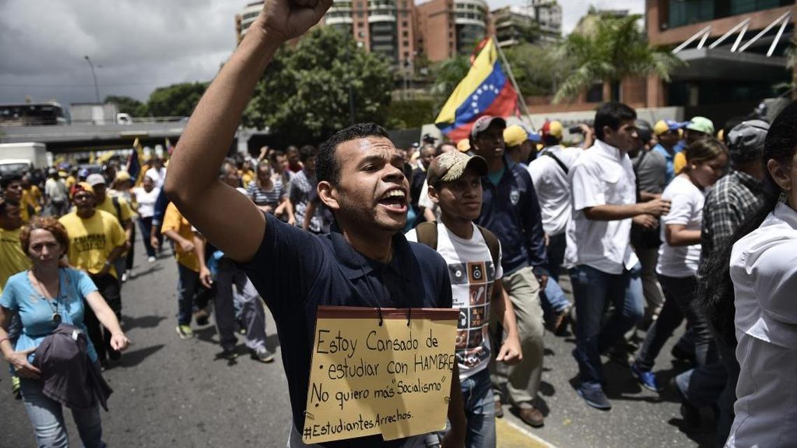 Protesters march towards the national electoral board (CNE) during a demonstration in support of a referendum on the rule of President Nicolas Maduro, not pictured, in Caracas, Venezuela, on Wednesday, July 27, 2016.