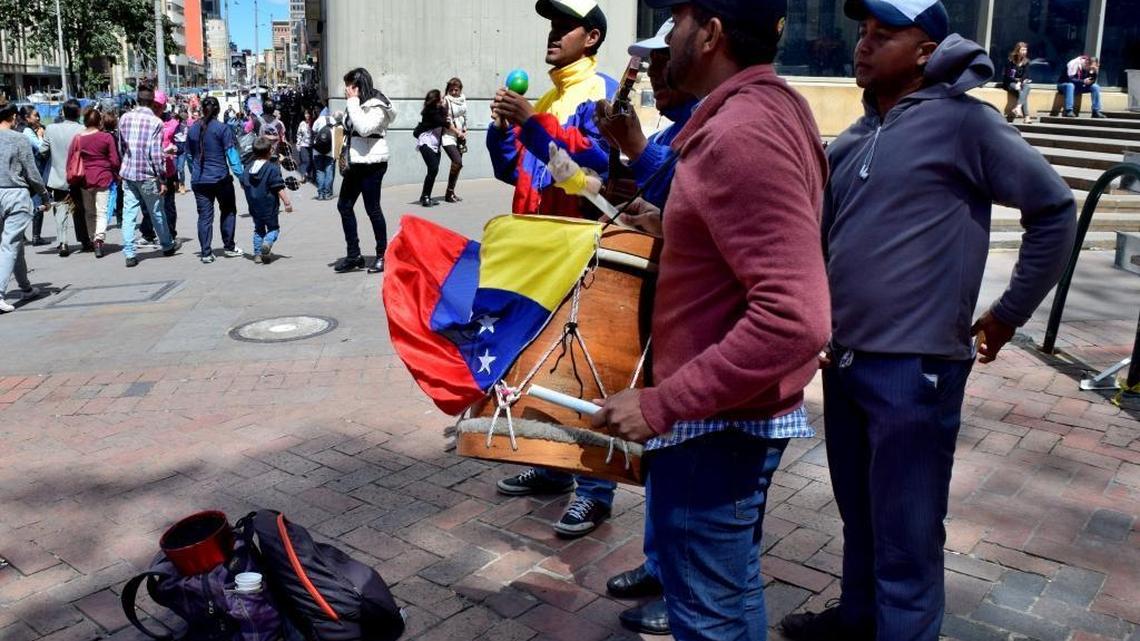 A Venezuelan folk band plays on the streets of Bogotá, Colombia. The number of Venezuelans in Colombia has increased 10-fold amid that nation’s economic collapse.