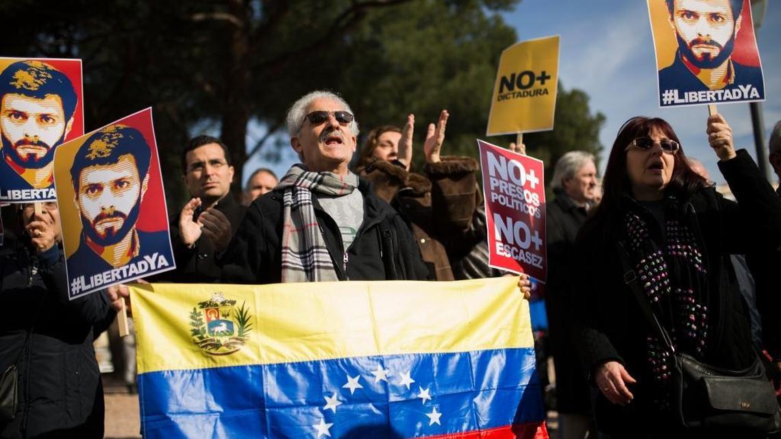 Protesters, some holding posters with the image of Venezuela’s jailed opposition leader Leopoldo López, shout slogans during a demonstration demanding the release of López and other jailed opposition leaders, in Madrid on Saturday, Feb. 18, 2017.