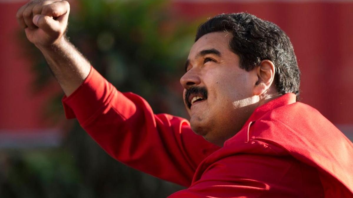 FILE - In this Dec. 1, 2015, file photo, Venezuela's President Nicolas Maduro gestures to supporters from the top of a car after the inauguration of cable car public transportation system, in the popular neighborhood of Petare, in Caracas, Venezuela. Allies of President Maduro are disputing the election of eight opposition candidates to the National Assembly, a move the opposition says seeks to undermine its landslide victory in legislative elections. On Tuesday, Dec. 29, 2015, the Supreme Court said it had received motions by losing candidates to overturn the results in several districts.