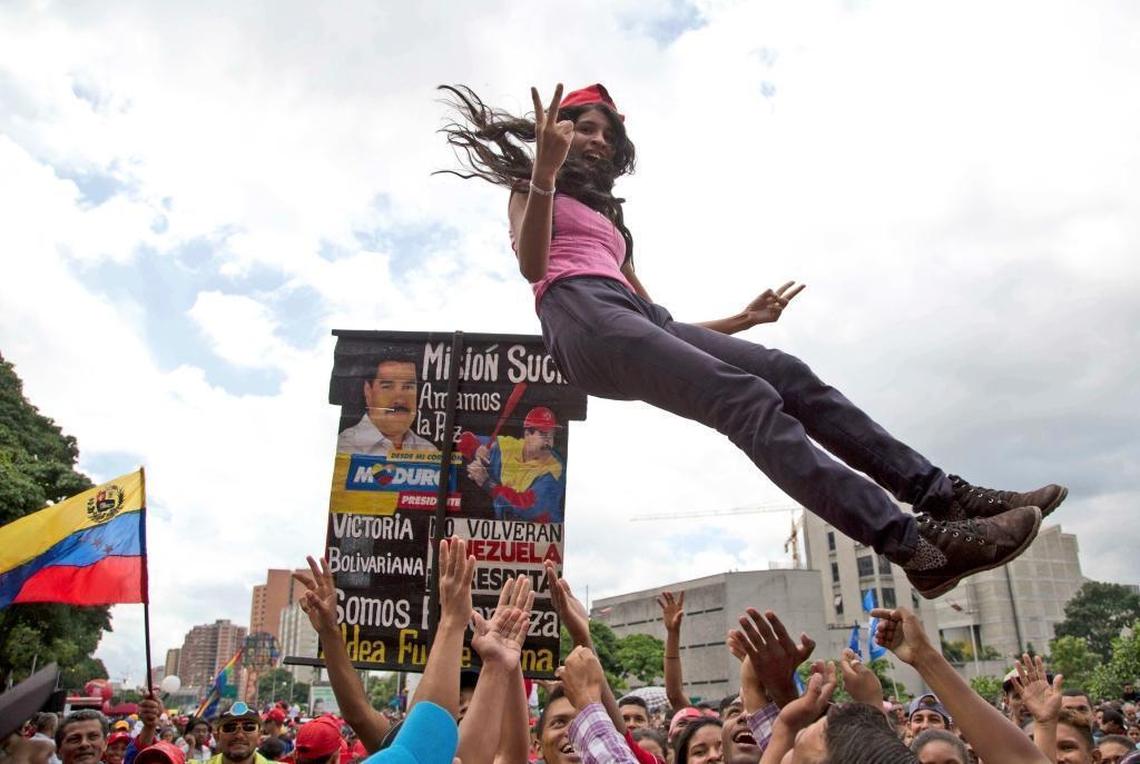 A woman celebrates the new constituent assembly’s installation in downtown Caracas.