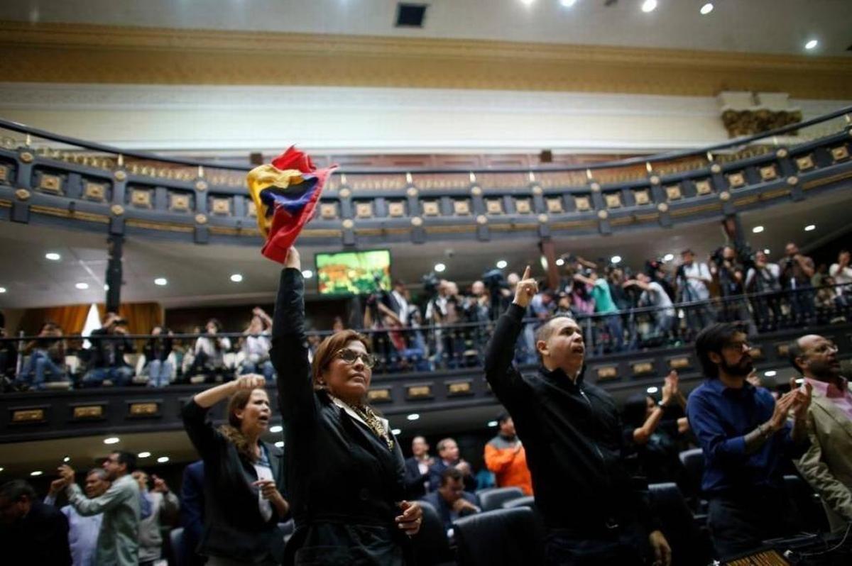 Anti-government lawmakers shout, “Fraud!” during a session of Venezuela’s National Assembly, in Caracas on Wednesday.