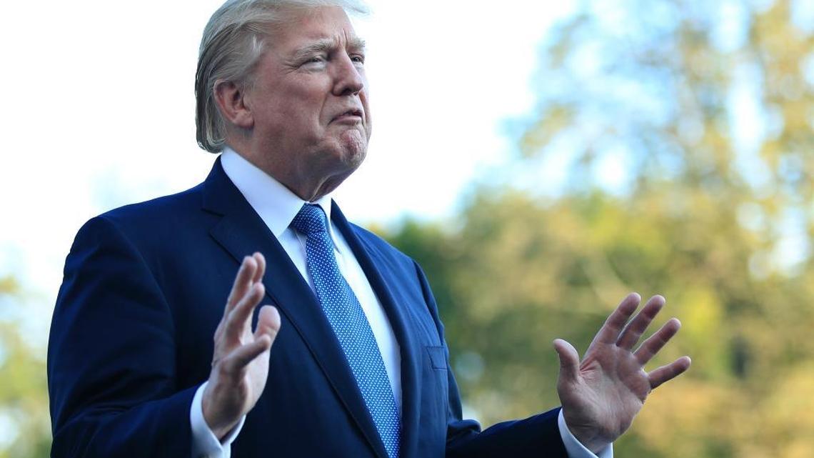 President Donald Trump speaks to reporters upon his return to the White House in Washington, Sunday, Sept. 24, 2017.