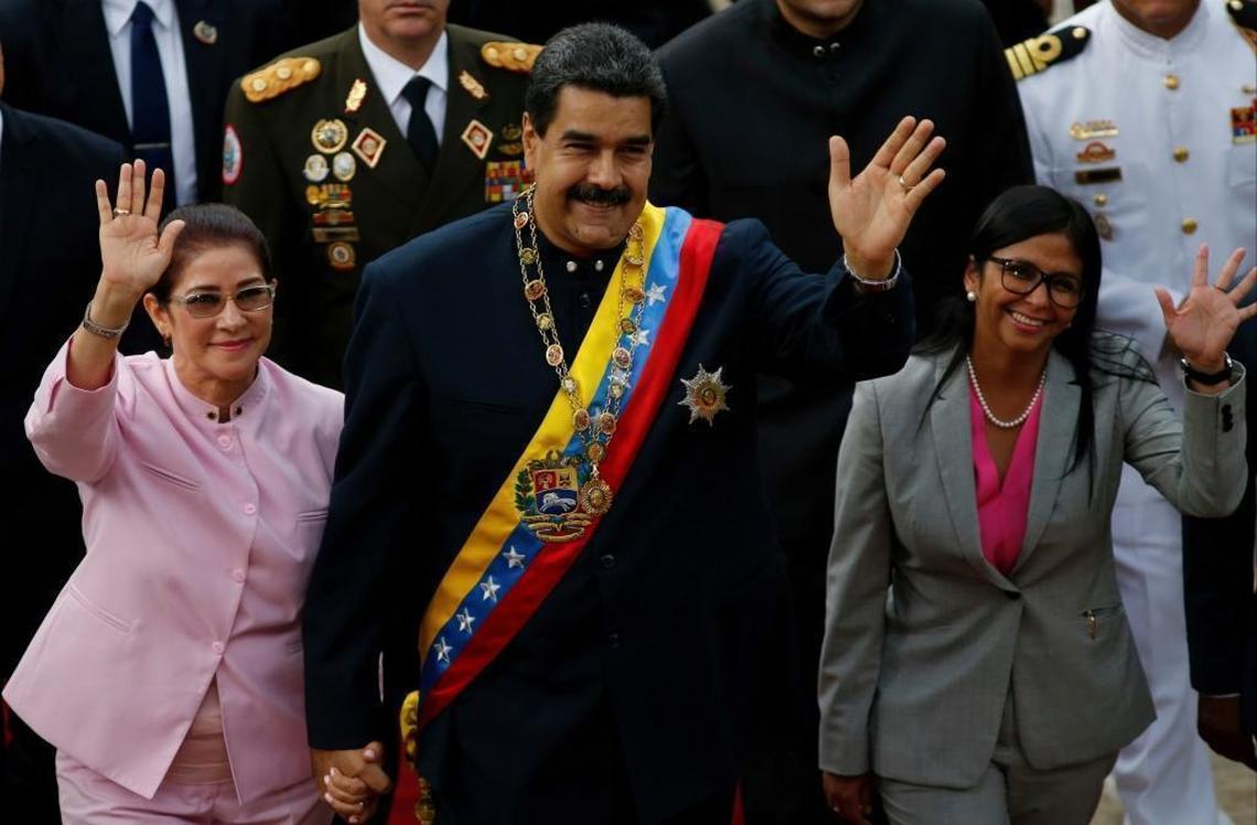 Venezuelan President Nicolás Maduro enters the legislative palace in Caracas on Thursday with his wife, Cilia Flores, left, and Delcy Rodríguez, president of the country’s new national constituent assembly.