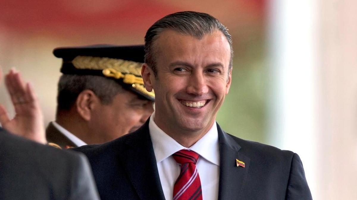 FILE - In this Feb. 1, 2017 photo, Venezuela's Vice President Tareck El Aissami, right, is saluted by Boilivarian Army officer upon his arrival for a military parade at Fort Tiuna in Caracas, Venezuela. The administration of President Donald Trump is slapping sanctions on El Aissami and accusing him of playing a major role in international drug trafficking. Thatâs according to individuals briefed on the U.S. government’s plans who requested anonymity to disclose the move ahead of a formal announcement.