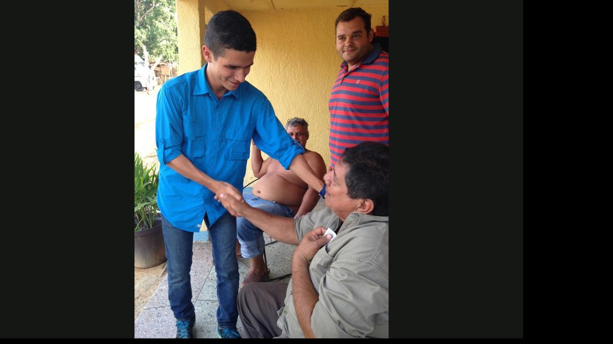 
In this Thursday, May 7, 2015 photo, Rafael Rico canvasses a neighborhood in Isla Margarita, Venezulea. Last year Rico was covering his baby face with a vinegar-soaked rag and dodging tear gas canisters as he clashed with Venezuelan riot police, now the 23-year-old engineering student is canvassing on the resort island of Margarita as he campaigns to represent the South American countryís opposition coalition in upcoming legislative elections. 
