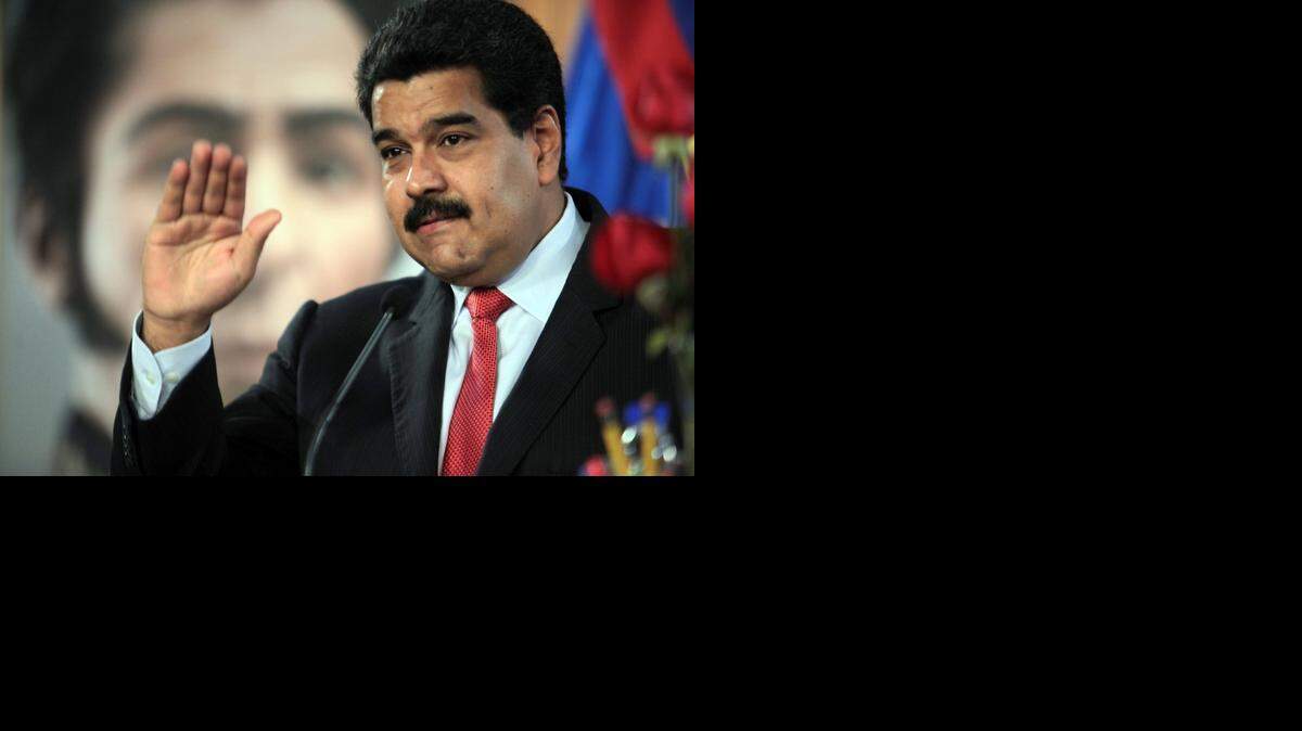
Handout photo released by the Venezuelan Presidency of Venezuelan President Nicolas Maduro as he gestures while speaking during a TV program at Miraflores presidential palace in Caracas on Sept. 2, 2014. Maduro made announcements of changes in his cabinet. 
