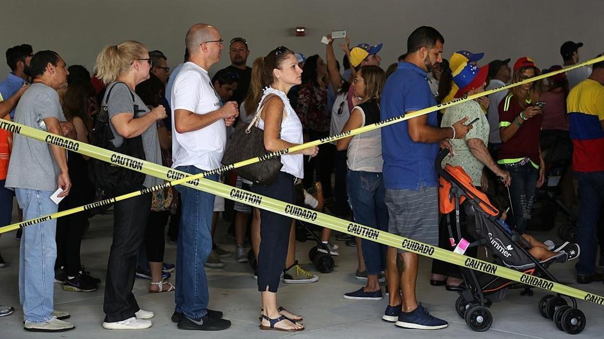 Thousands of Venezuelan nationals line up at the polls Sunday at Miami Dade College’s West Campus to vote on whether the country should hold a constitutional referendum.