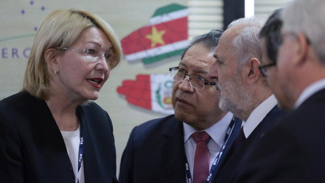 Venezuela's Chief Prosecutor Luisa Ortega Diaz, second left, talks with her counterparts during a meeting of Mercosur trade bloc prosecutors, in Brasilia, Brazil, Wednesday, Aug. 23, 2017. Brazil's attorney general is sharply criticizing the recent ouster of his counterpart in Venezuela. Attorney General Rodrigo Janot said Wednesday that the removal of Ortega Diaz from her post was "an institutional rape" and that it eroded the independence of Venezuela's justice system.