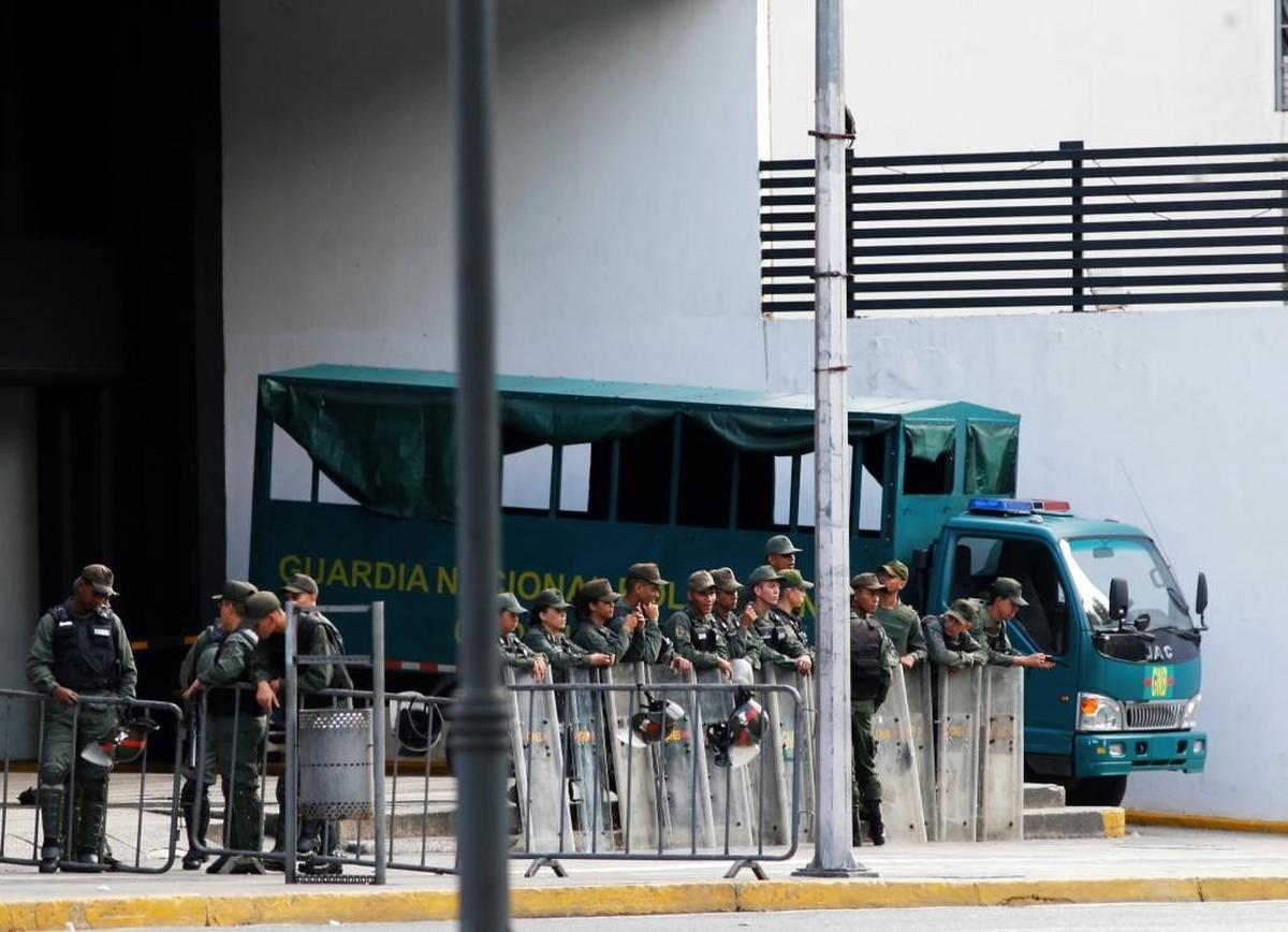 Venezuelan Bolivarian National Guard officers lineup outside of Public Ministry in Caracas on Saturday.
