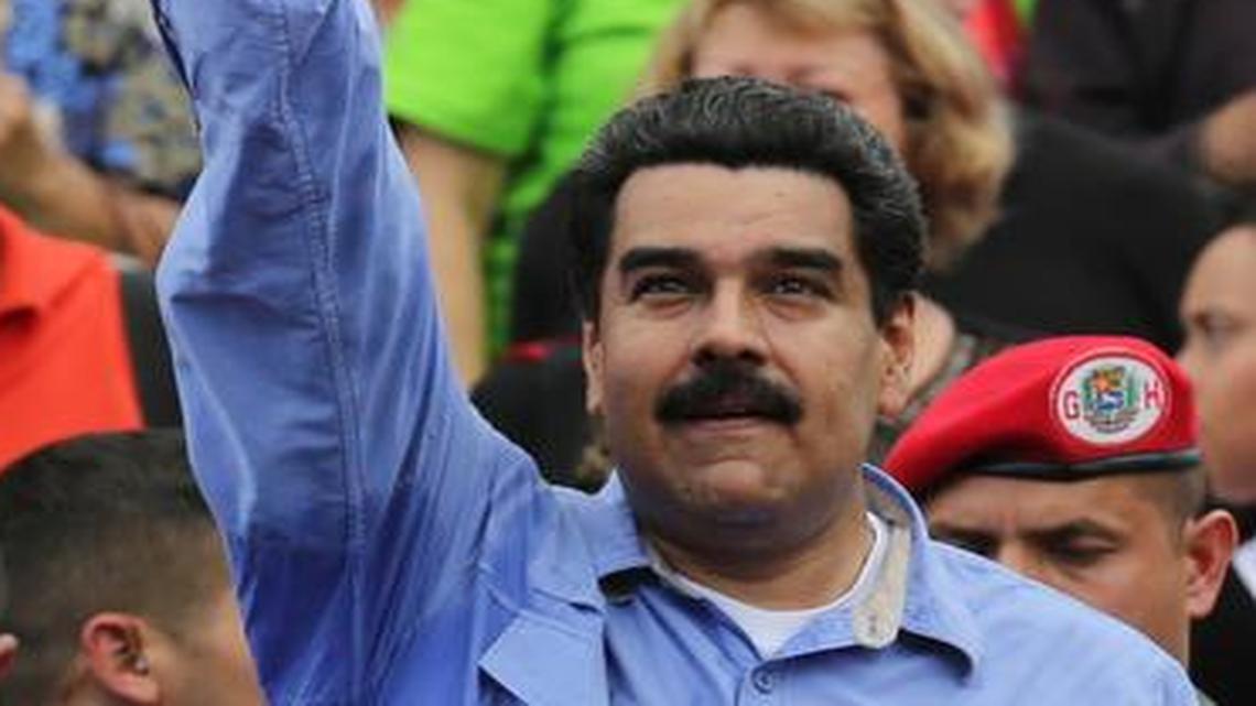 
Venezuela’s President Nicolas Maduro waves to his supporters during a rally to commemorate the end of Marcos Perez Jimenez's dictatorship 57 years ago, in Caracas, Venezuela, Friday, Jan. 23, 2015. 
