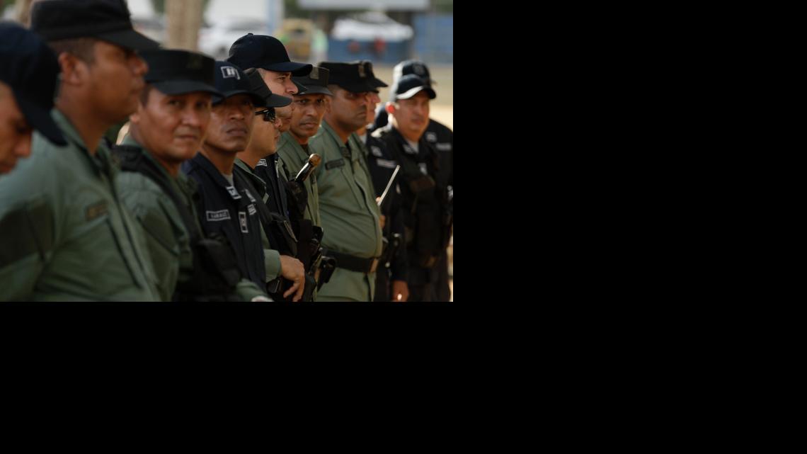 
Police officers line up as they guard a pro-Venezuela demonstration in Urraca Park, Panama City, Wednesday, April 8, 2015. Panama City will host the VII Summit of the Americas on April 10-11, which tensions between Caracas and Washington threatened to overshadow a thaw in U.S.-Cuba relations. 
