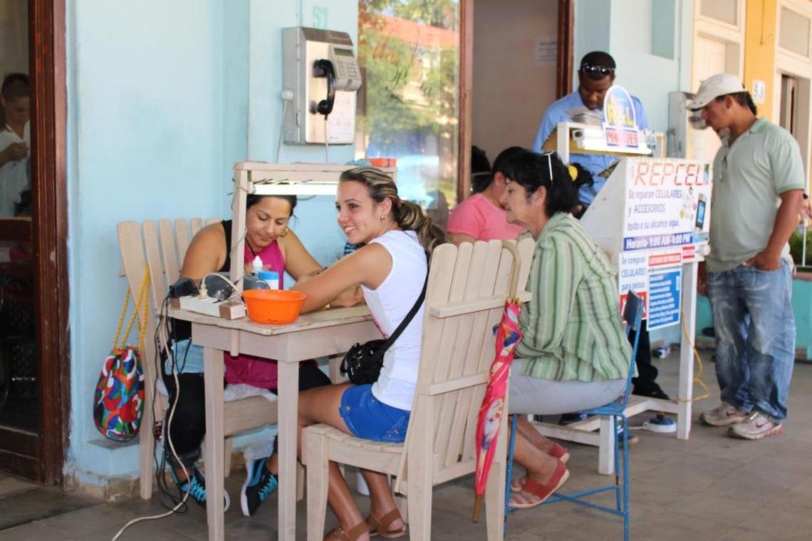 Cuentapropistas from manicurists to cellphone repairmen have set up shop along Calle Salvador Cisneros, the main street in Viñales, Cuba.