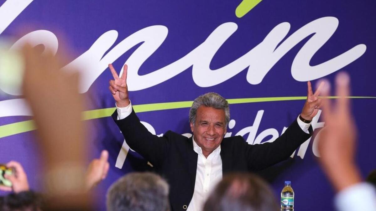 Lenin Moreno, presidential candidate for the ruling party Alliance PAIS, greets supporters as he arrives to await the results of the general election, in Quito, Ecuador, Sunday, Feb. 19, 2017.