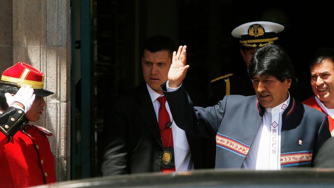 Bolivia's President Evo Morales waves to his supporters as he leaves the government palace in La Paz on Wednesday.