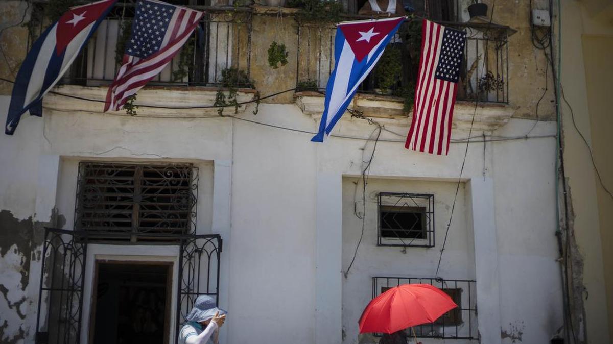 
Cuban and U.S. flags hang from a resident's balcony on the day the U.S. opened its embassy in Havana, Cuba, Friday, Aug. 14, 2015. U.S. Secretary of State John Kerry and his Cuban counterpart Bruno Rodriguez said their nations would continue to disagree over issues such as democracy and human rights. But they also said they hoped to make progress on issues ranging from maritime security and public health to the billions of dollars in dueling claims over confiscation of U.S. property and the U.S. economic embargo on the island. 
