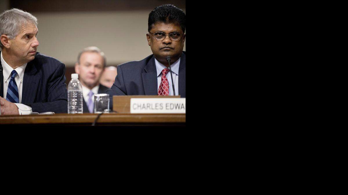 
Mark Sullivan (L), Director of the United States Secret Service, looks toward Charles K. Edwards, Acting Inspector General of the US Department of Homeland Security, during a a hearing of the Senate Homeland Security and Government Affairs Committee on Capitol Hill May 23, 2012 in Washington, DC. Sullivan was called to testify about the prostitution scandal involving members of the Secret Service in Cartagena, Columbia prior to a visit by President Barack Obama. 
