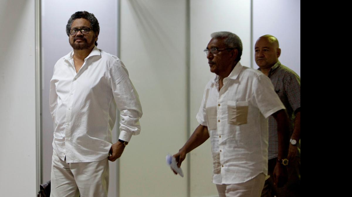 
Ivan Marquez, chief negotiator for the Revolutionary Armed Forces of Colombia, or FARC, left, arrives for a new round of peace talks with Colombia's government in Havana, Cuba,Wednesday, June 17, 2015. Contentious issues like demobilization of FARC operatives, blame for human rights abuses committed by all sides during the conflict and political reform has slowed the pace of the peace talks that have gone on for two years, with renewed fighting on the ground further limiting progress.
