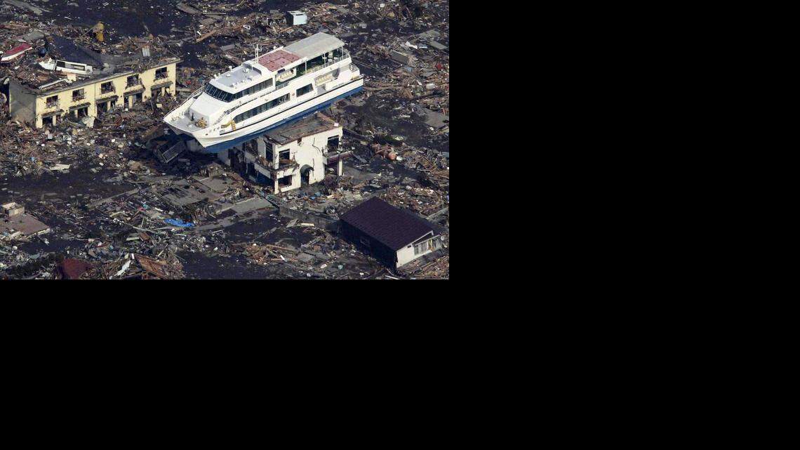 
This file aerial shot shows a pleasure boat sitting on top of a building amid a sea of debris in Otsuchi town in Iwate prefecture on March 14, 2011 following the March 11 tsunami. A nuclear power plant damaged by An explosion also rocked the earthquake-hit Fukushima nuclear plant.


