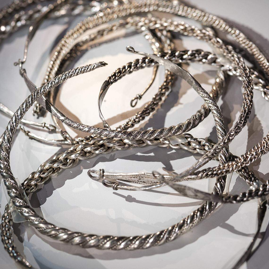 A pile of Viking-era silver necklaces found in Täby and restored.