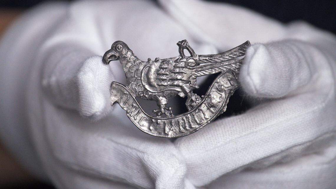 Archaeologists uncovered a centuries-old artifact, a turtle dove with a Latin phrase about love, during work in Gdańsk, a museum said and photo shows.