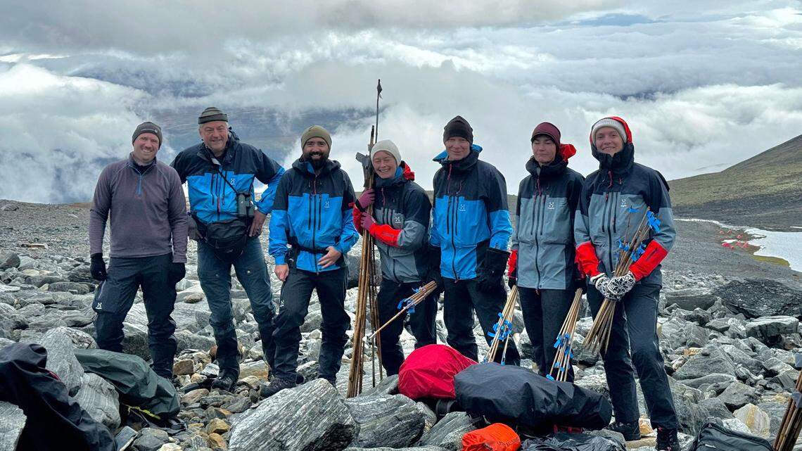 Archaeologists surveying the Lendbreen glacier found a centuries-old woven textile and a leather or hide item melting out of the ice, photos show.