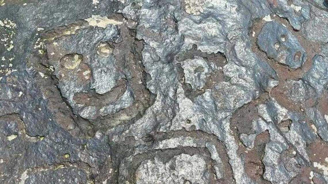 Ancient drawings of expressive human faces reemerged on a river bank in Manaus, Brazil, due to record-breaking drought, photos show.