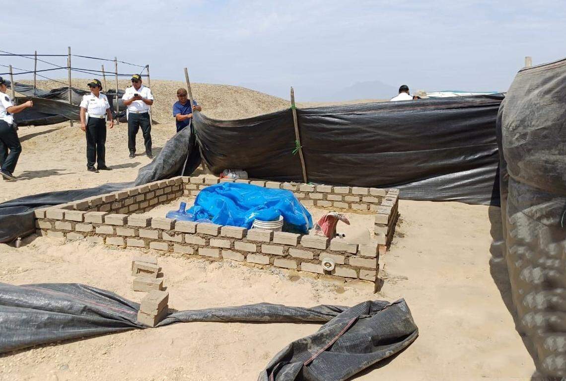 A photo shows a half-built illegal structure at Chan Chan Archaeological Zone.